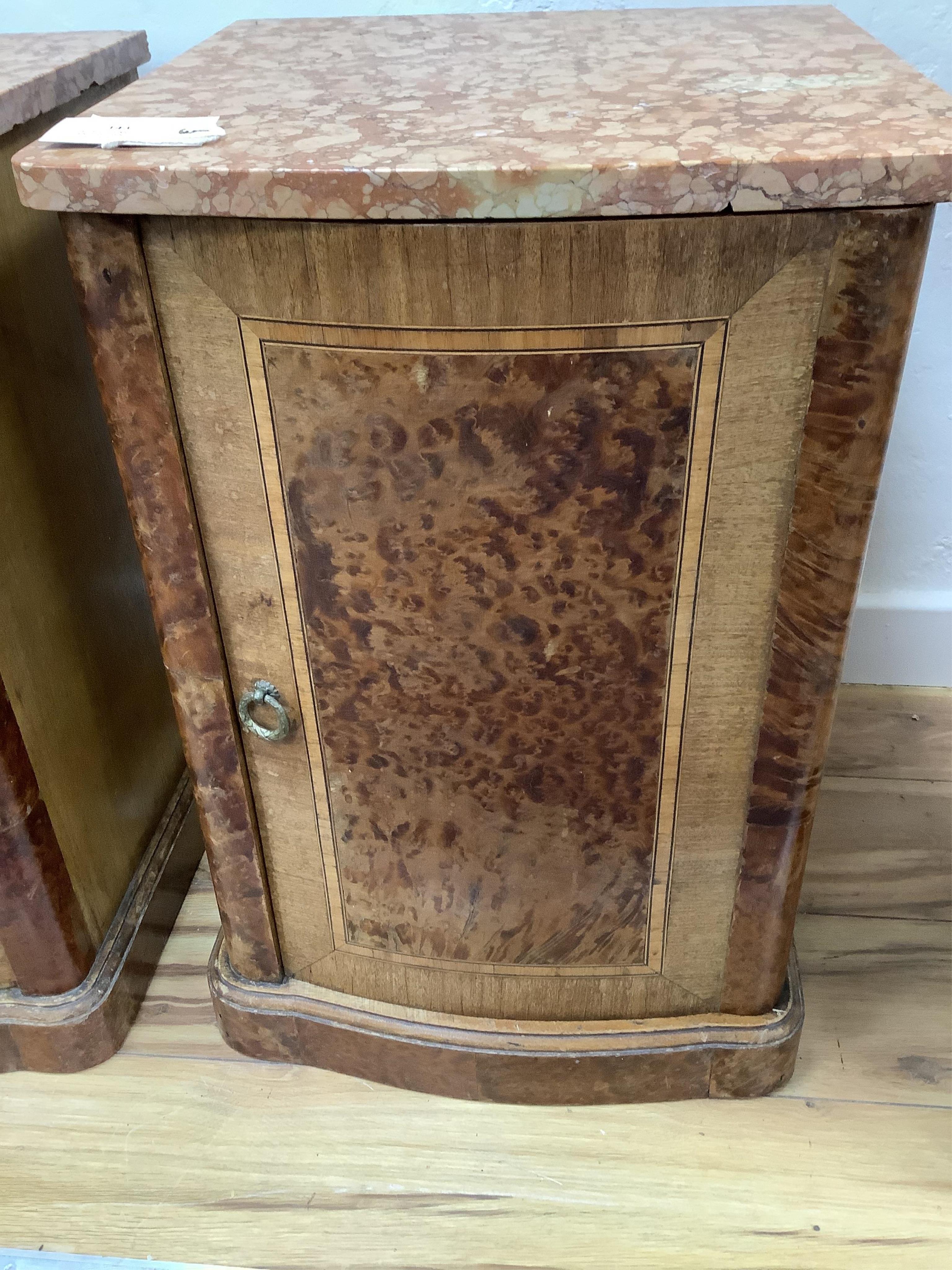 A pair of early 20th century French amboyna and mahogany marble top bedside cabinets, width 40cm, depth 43cm, height 58cm. Condition - fair